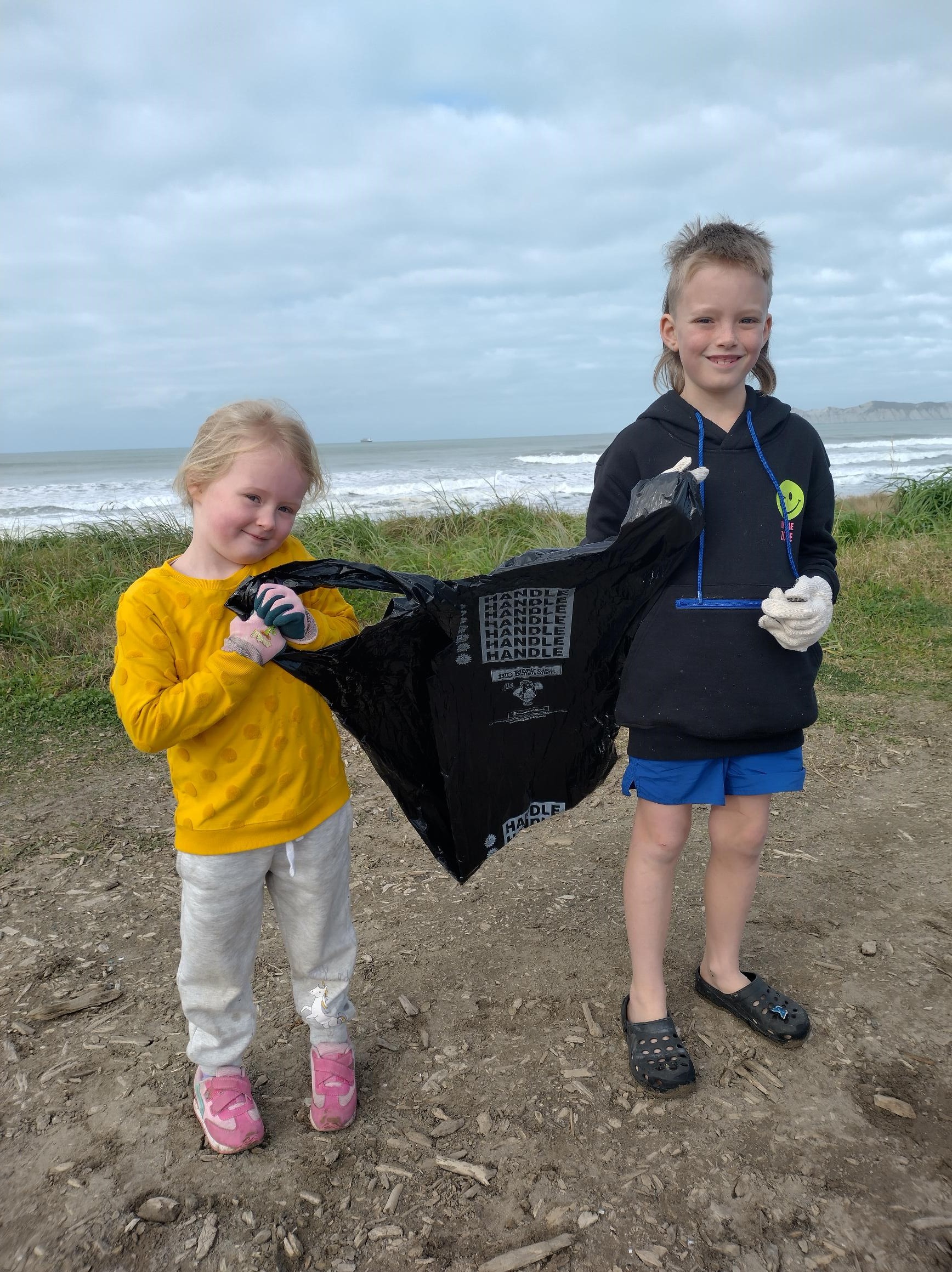 Eve and Ryder Elsmore at beach clean up 2023